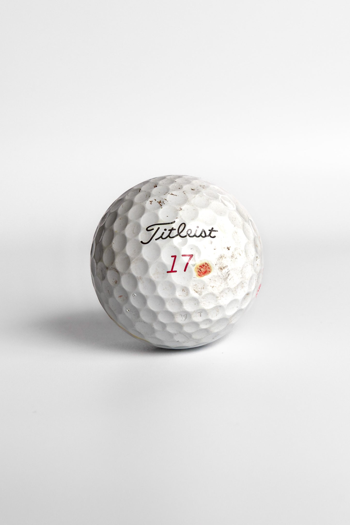 Titleist Pro V1x golf ball with red number seventeen and dot mark white background