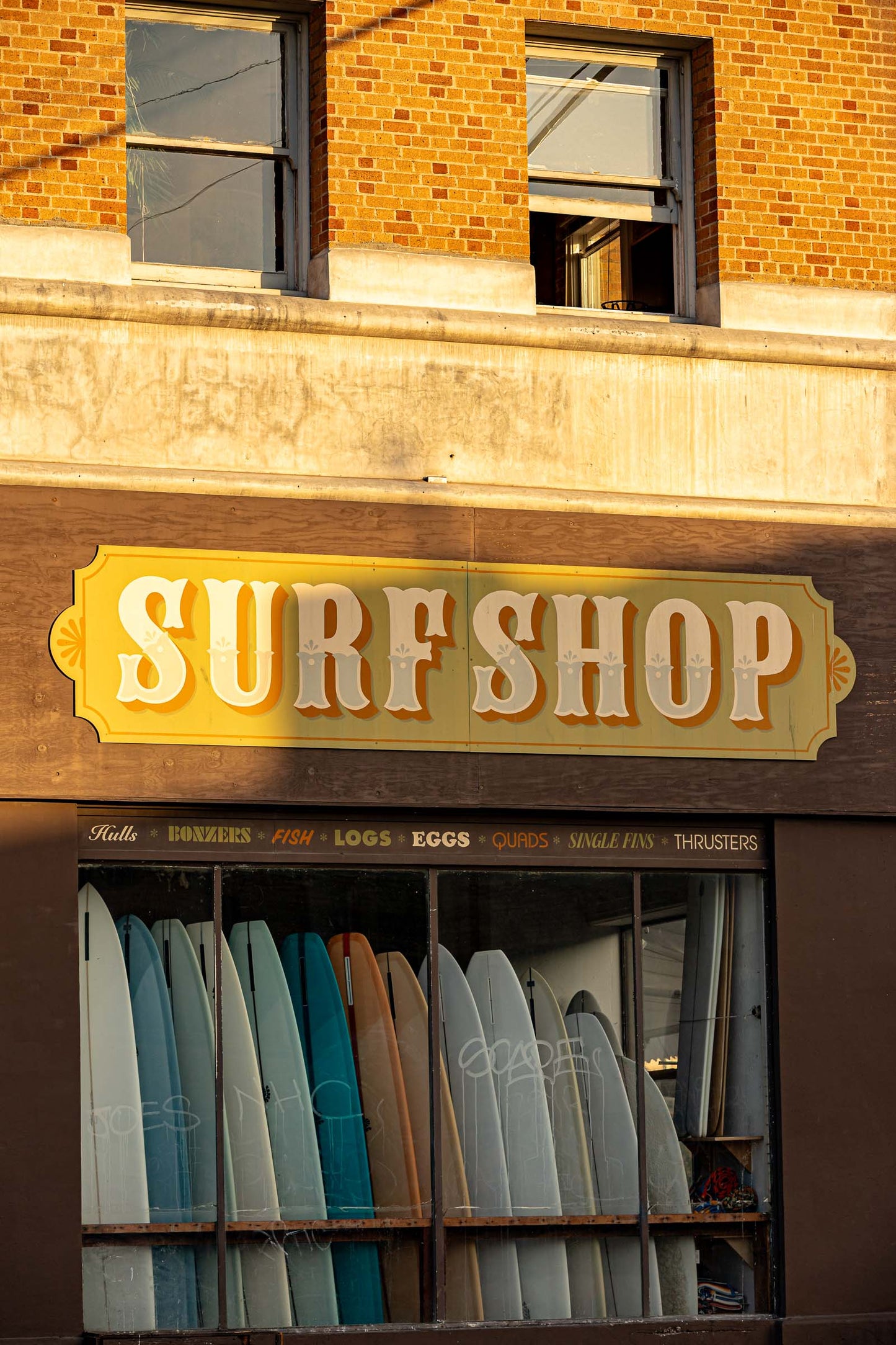Venice Beach surf shop storefront with surfboards and beach culture signage in California
