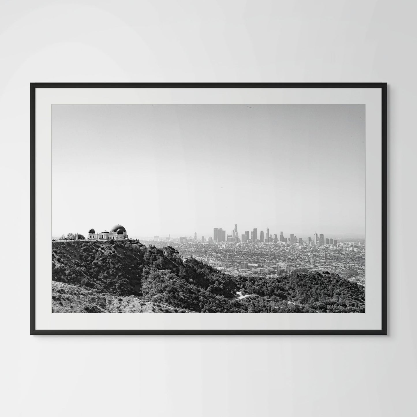 Black and white Los Angeles cityscape framed photography print in black wood frame