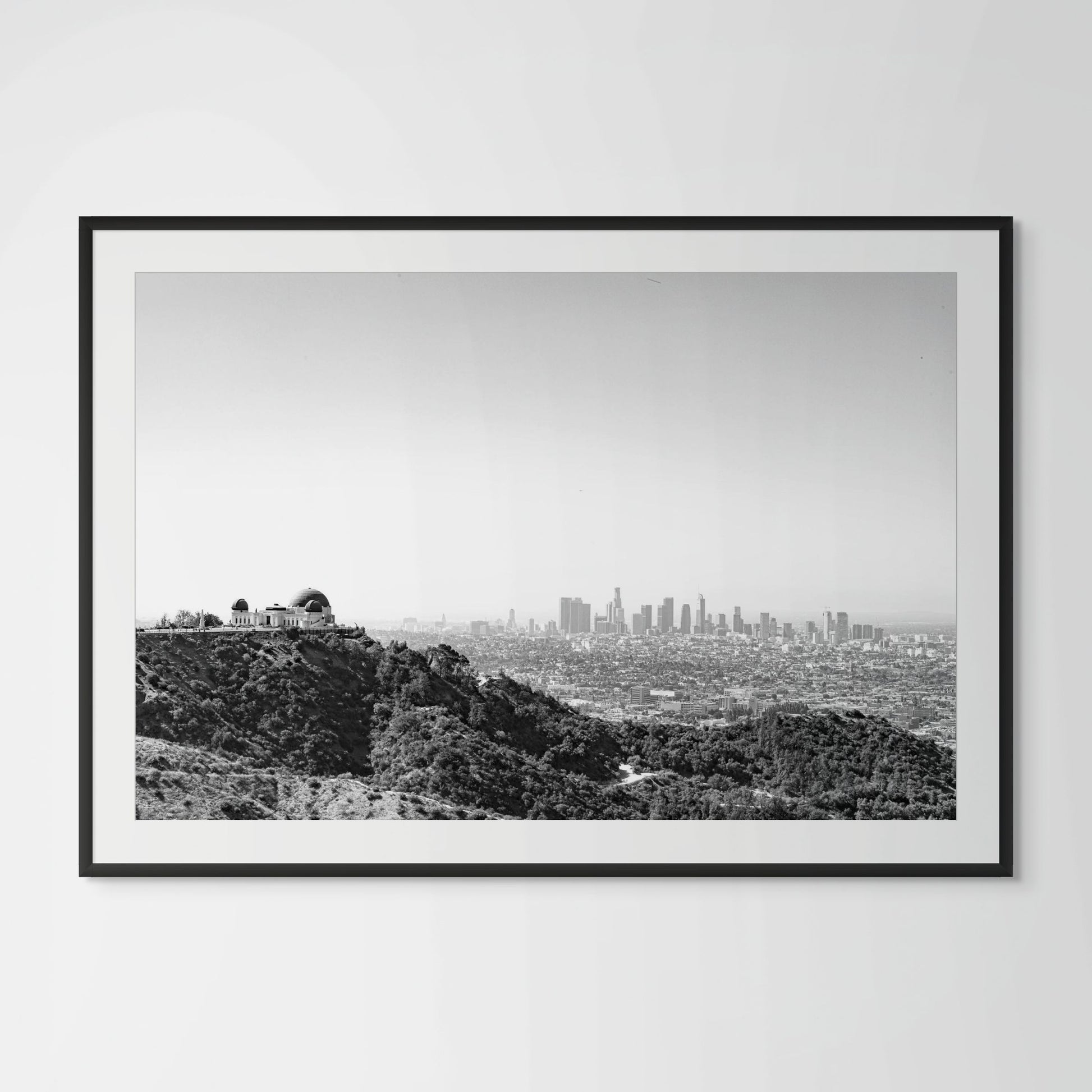 Black and white Los Angeles cityscape framed photography print in black wood frame
