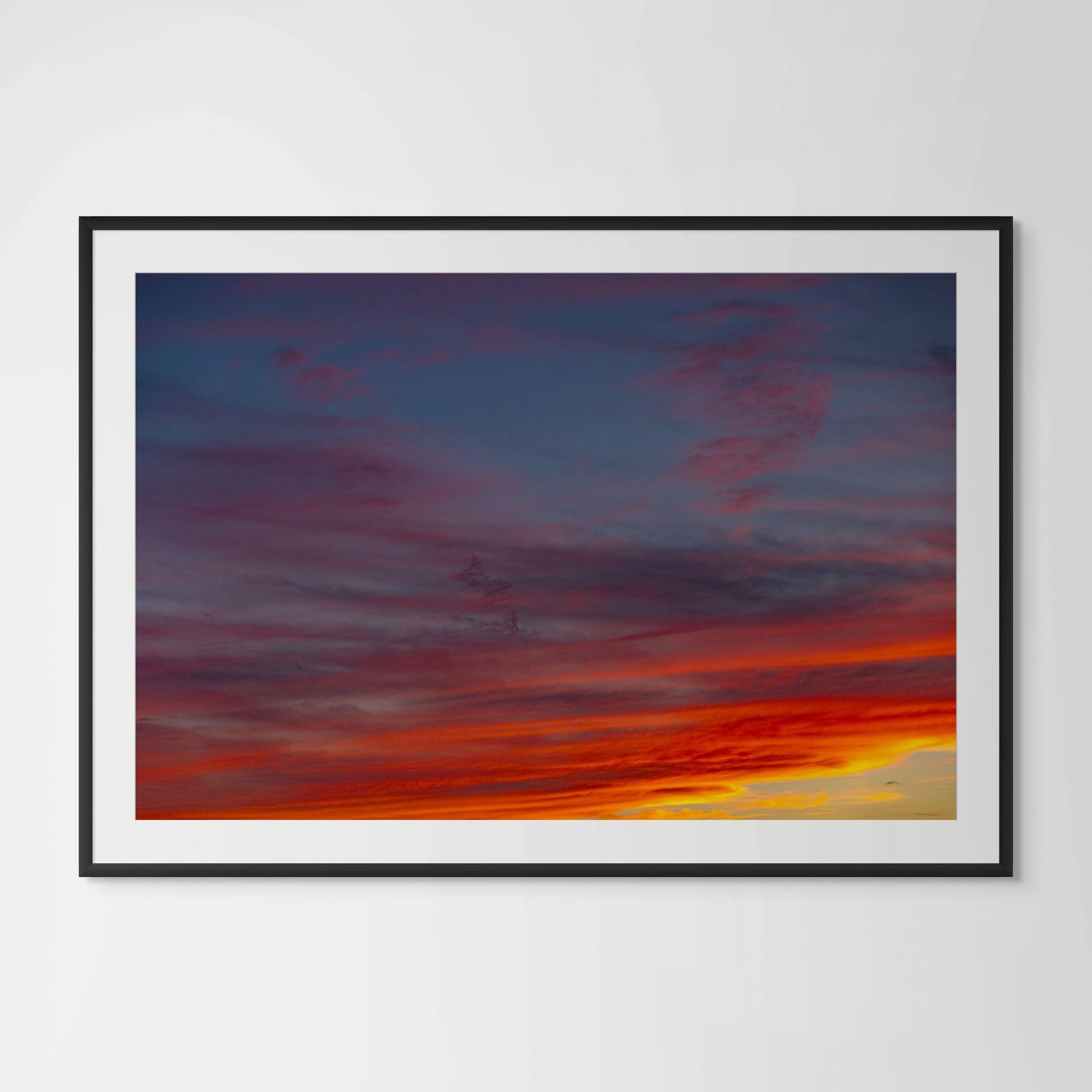 Sunset Hills layered cloud photography framed print in black wood frame with white mat