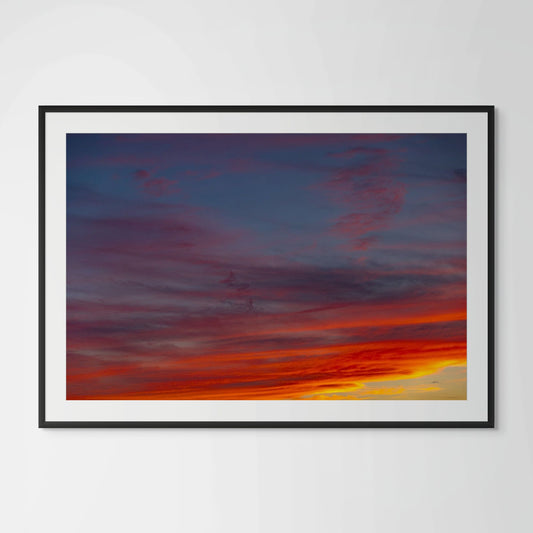 Sunset Hills layered cloud photography framed print in black wood frame with white mat