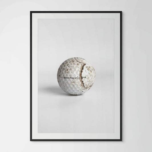 Titleist Pro V1 aged cracked golf ball framed photography print in black wood frame