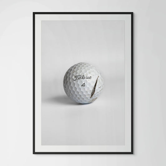 Titleist Pro V1 clean cracked golf ball framed photography print in black wood frame
