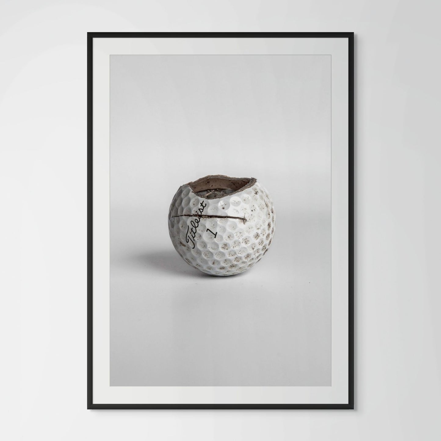 Titleist Pro V1 equator crack golf ball framed photography print in black wood frame