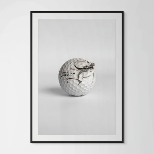 Titleist Pro V1 fractured golf ball framed photography print in black wood frame