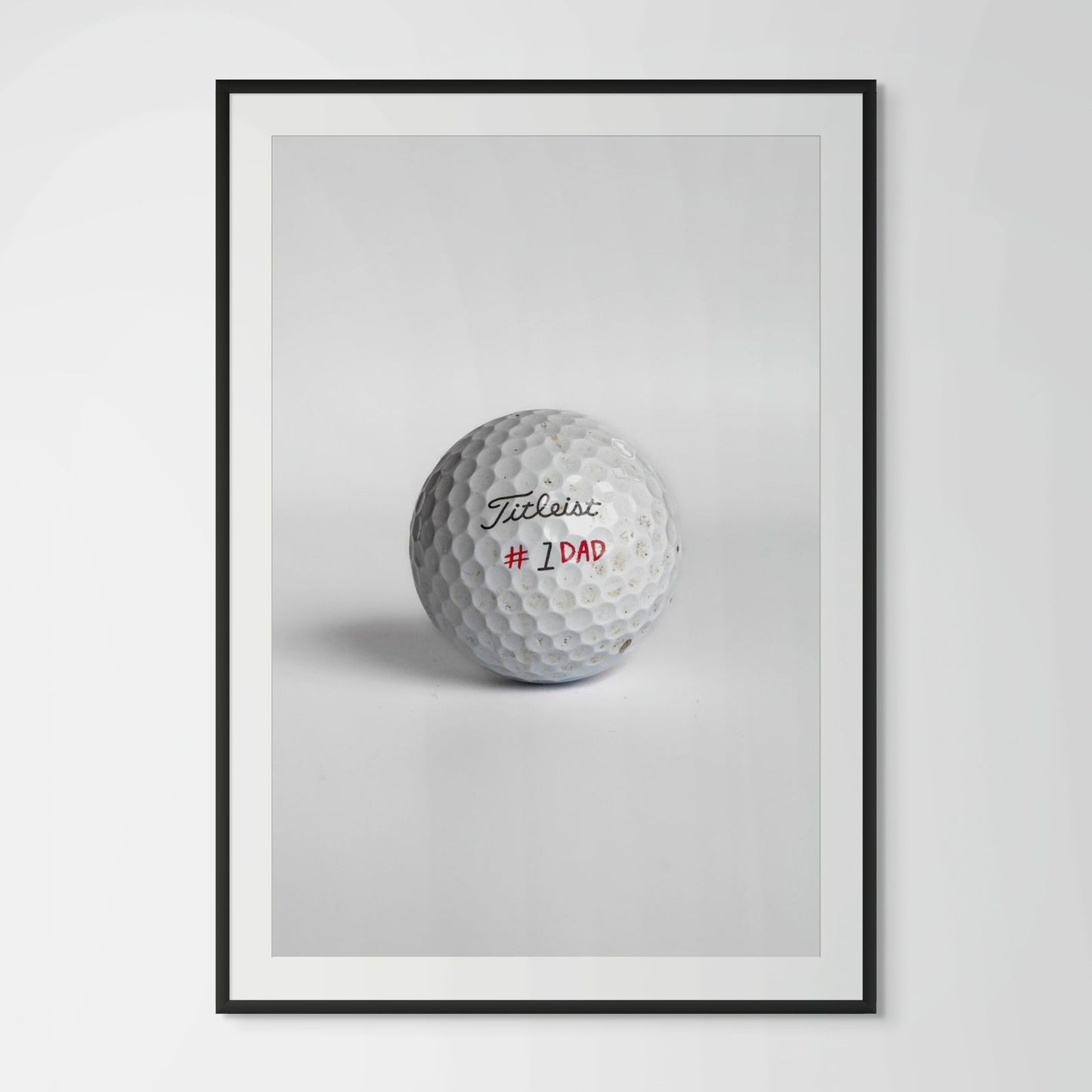 Titleist Pro V1 number one dad golf ball framed photography print in black wood frame