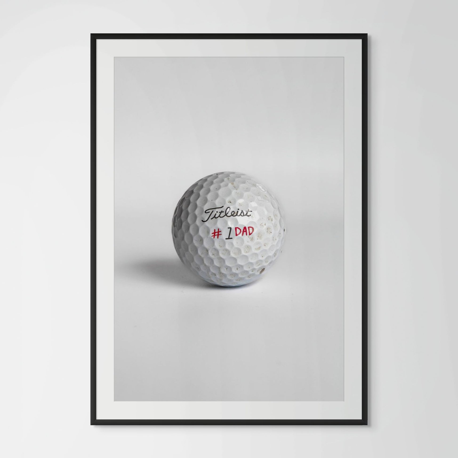 Titleist Pro V1 number one dad golf ball framed photography print in black wood frame