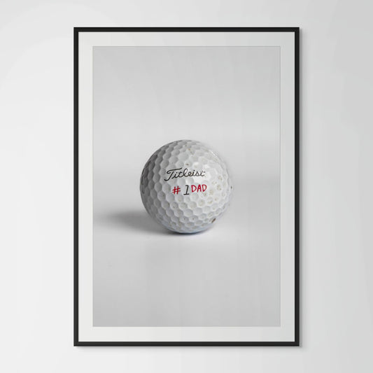 Titleist Pro V1 number one dad golf ball framed photography print in black wood frame