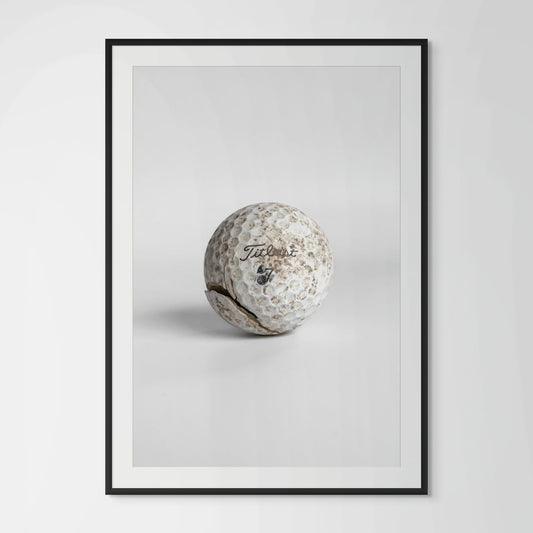 Titleist Pro V1 worn dirty golf ball framed photography print in black wood frame