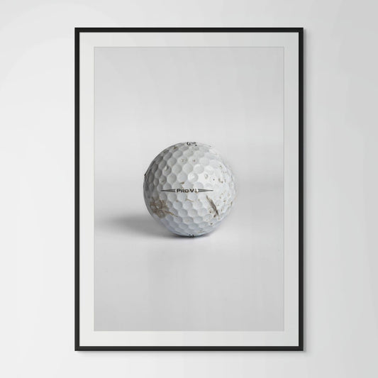 Titleist Pro V1 scuffed golf ball framed photography print in black wood frame