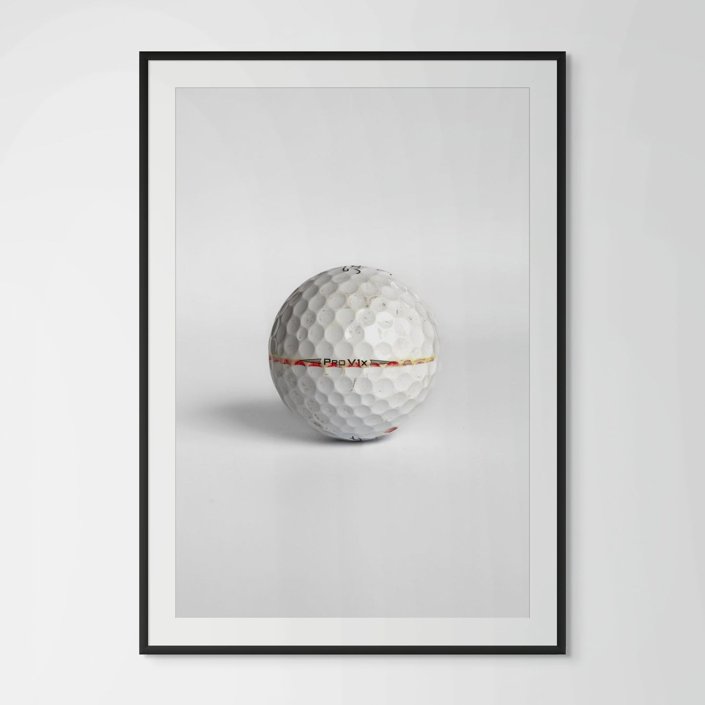Titleist Pro V1x faded red stripe golf ball framed photography print in black wood frame
