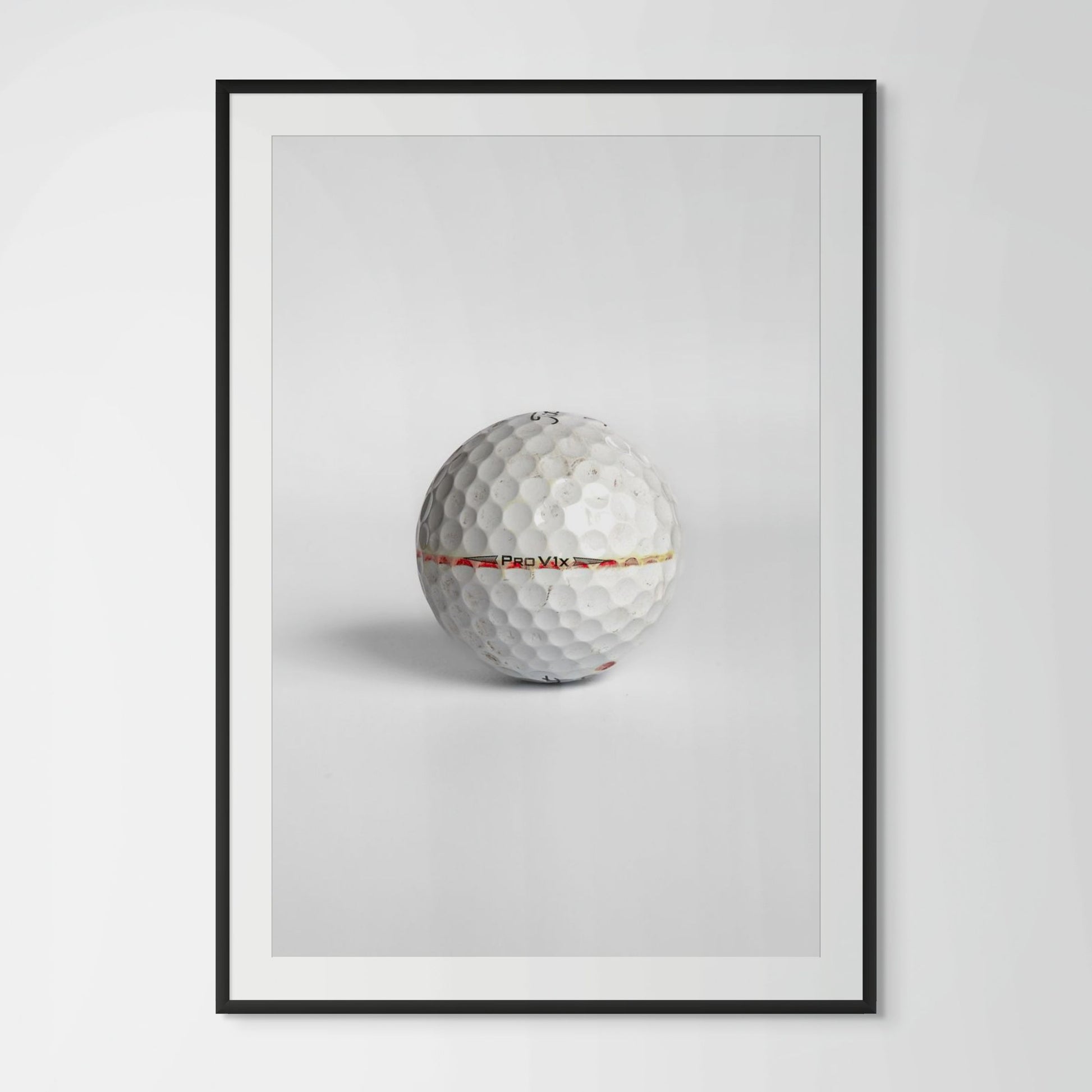 Titleist Pro V1x faded red stripe golf ball framed photography print in black wood frame