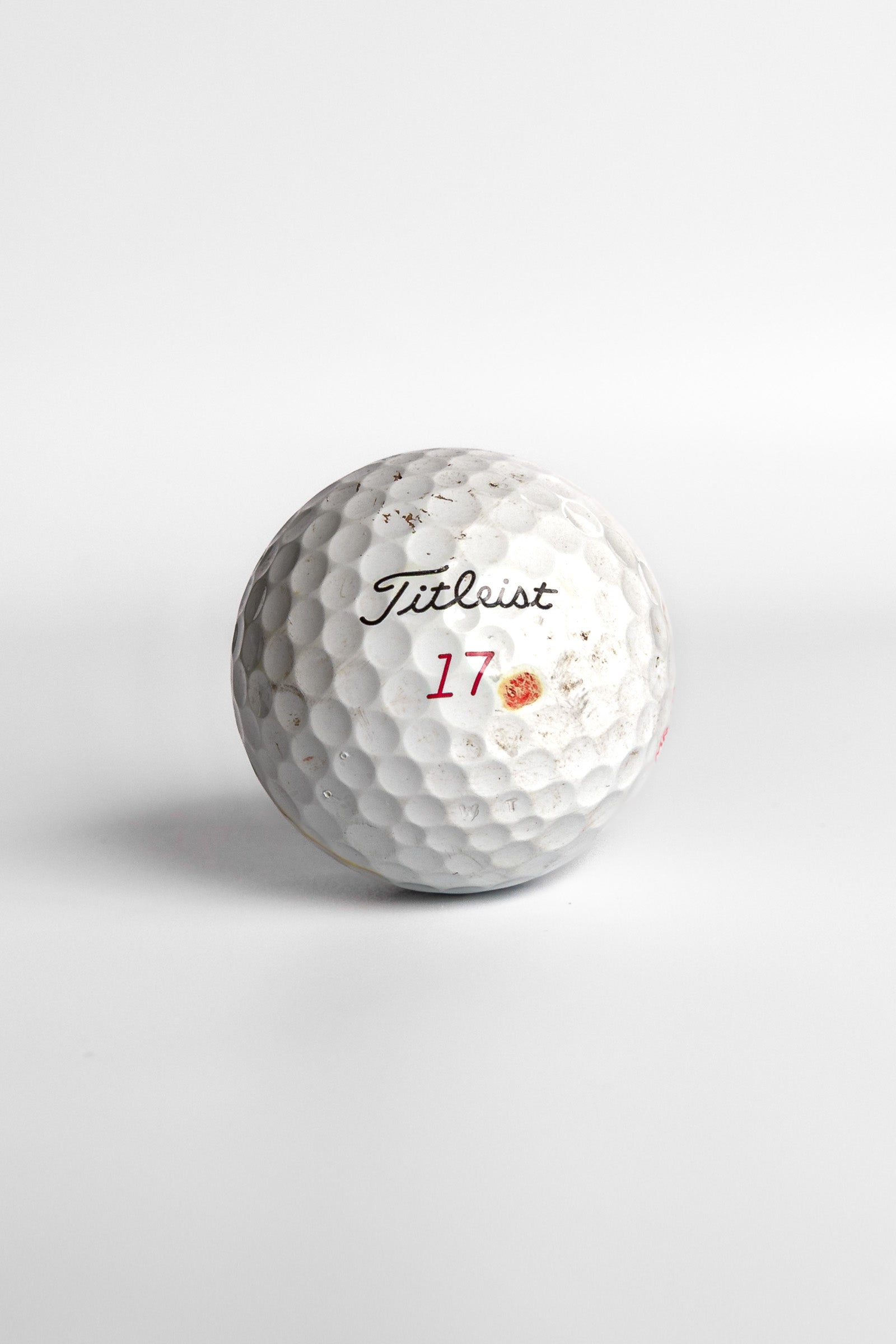 Titleist Pro V1x golf ball with red number seventeen and dot mark white background