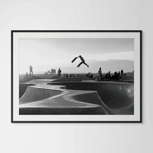 Venice Beach skatepark aerial trick black and white framed photography print in black wood frame